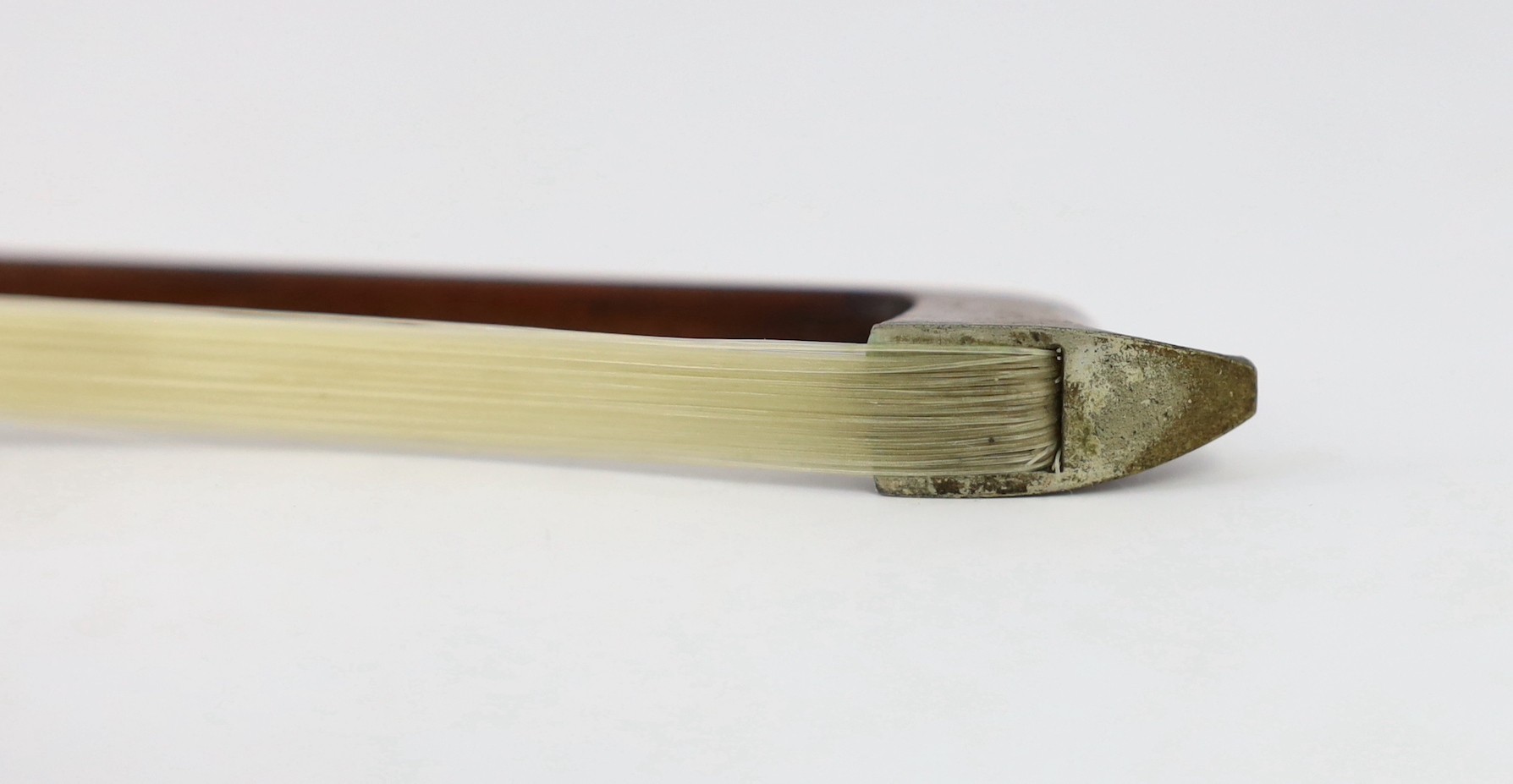 A silver mounted violin bow, stamped DODD, another stamped TOURTE and another bow